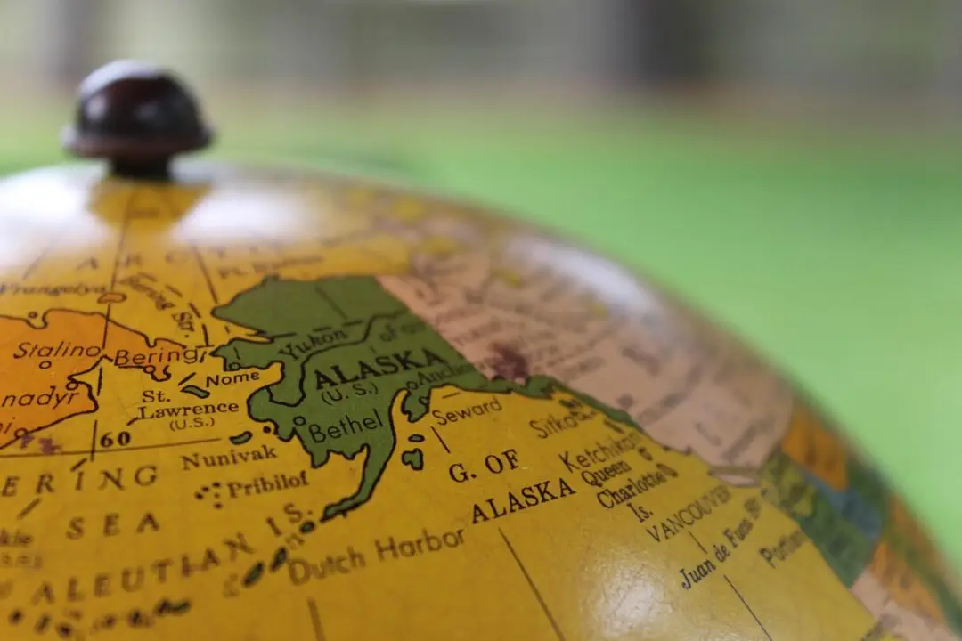 Vintage globe showing Alaska in green